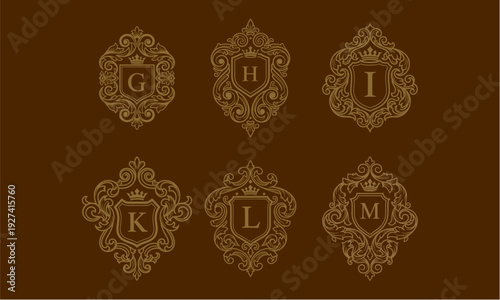 Ornate golden emblems with letters on a brown background, displayed in two rows, showcasing intricate designs from a direct viewpoint