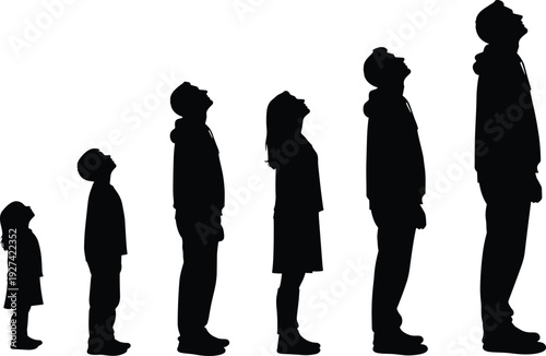 Silhouette of family group including children and adults standing in line looking up at sky for growth and future concept.