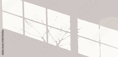 Shattered glass reflects tree branches against a large window in a serene indoor setting viewed from a low angle