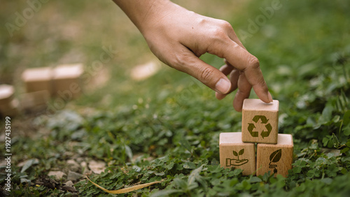 Cuadro en lienzo Hand Stacking Recycling and Green Energy Wooden Blocks on Nature Background, Sus