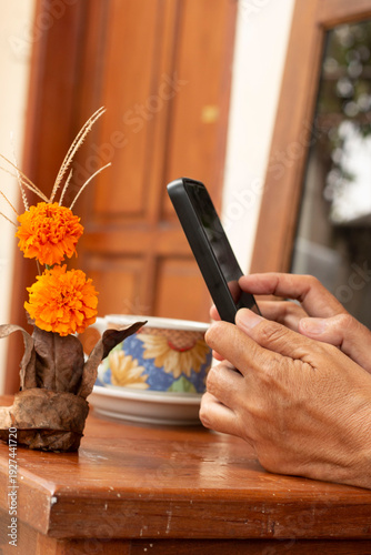 Marigold Flower Beside Digital Tablet – Nature and Technology Concept