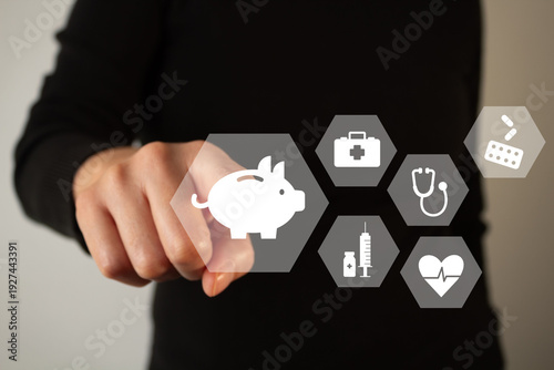 Health insurance savings. A person's hand points to a piggy bank icon surrounded by medical-related icons.