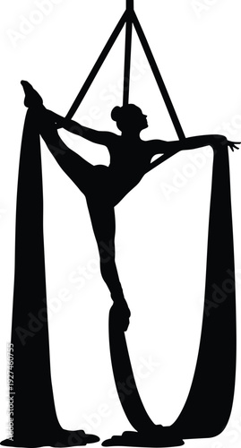 Aerial silk performer silhouette of a gymnast dancing and stretching in the air for circus arts fitness gymnastics and athletic performance