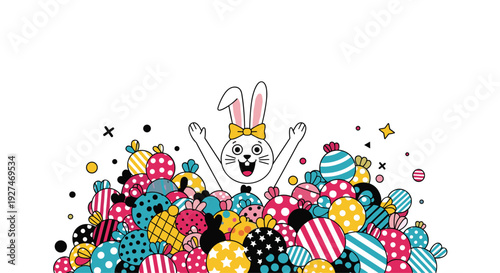 Happy white rabbit with a yellow bow appearing from behind a large pile of colorful patterned candies and sweets against a clean white background.