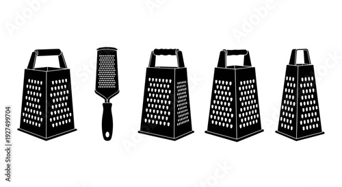 Four black plastic cheese graters and a brush on white background kitchen utensils for food preparation