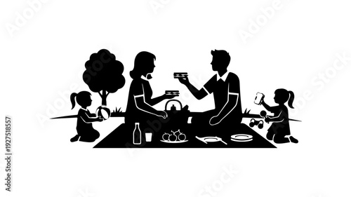 Happy family enjoying picnic together in the park