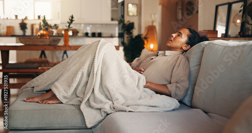 Foto Frustrated, woman and stomach ache with pain on sofa for indigestion or menstruation cycle in home