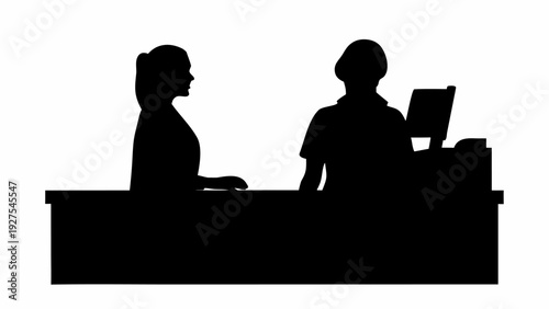 Silhouetted businesswoman and colleague in modern office setting