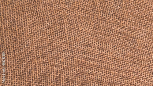 Detailed close-up of natural burlap fabric texture with woven pattern. Brown sackcloth texture or background and empty space. Jute burlap canvas texture. Background for text and picture.