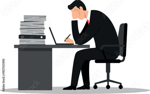 Stressed Businessman Working Late At Desk With Stack Of Papers And Laptop