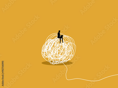 businessman works on his laptop amidst the chaos