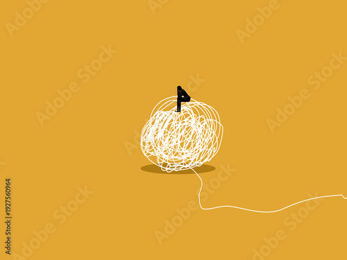 businessman sat dejected amidst the chaos