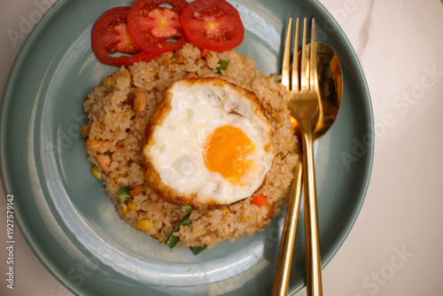 fried rice with egg and fresh cucumber slices