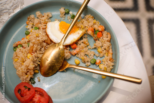 fried rice with egg and fresh cucumber slices