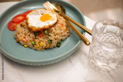 fried rice with egg and fresh cucumber slices