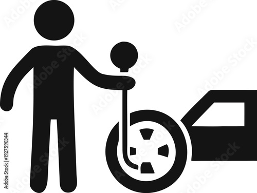 Driver performing wheel service for vehicle maintenance using specialized equipment