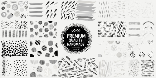 Assorted black and white brushstrokes dots and patterns with a premium label