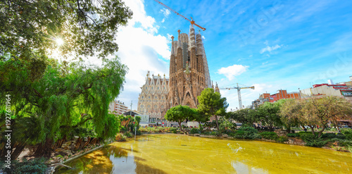 View of the unfinished Sagrada Familia on a sunny day in Barcelona, Spain. Sagrada Familia is a famous landmark symbolizing Barcelona’s cultural, religious, and architectural heritage.