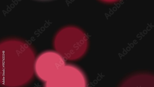 Blurry red hearts floating on a dark background with subtle bokeh effect