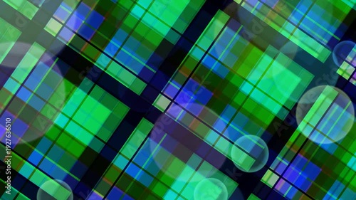 Vibrant geometric shapes on a blurred background with green and blue hues viewed from a diagonal perspective