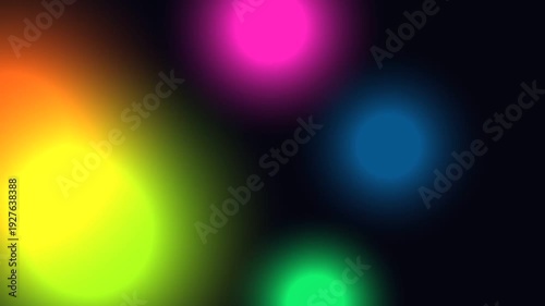 Multicolored lights on a dark background viewed from a straight-on perspective.