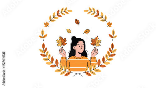 Young woman wearing a striped sweater smiles as she holds two autumn leaves inside a decorative wreath of falling orange and yellow foliage.