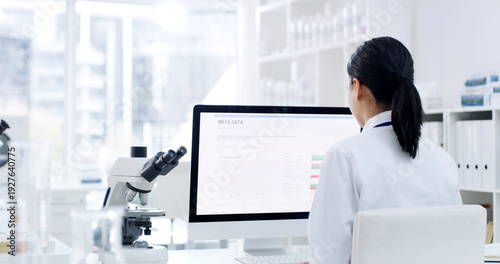 Photos Woman, scientist and reading with computer in lab for research, experiment and medical report