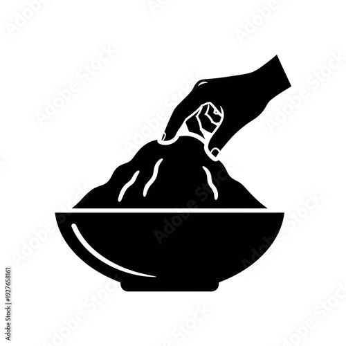 Hand scooping flour from bowl.