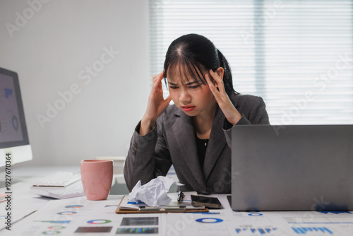 Quadro su tela Overwhelmed young businesswoman experiencing stress and headache from demanding
