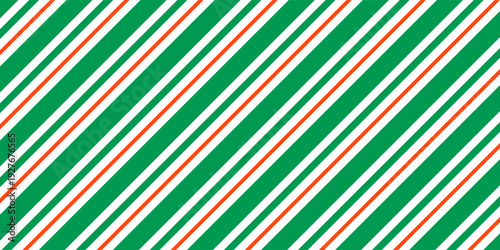 Christmas seamless pattern. Red and green diagonal stripes background. Candy cane repeating decoration wallpaper. Winter holiday lines backdrop. Xmas peppermint present wrapping print design. Vector