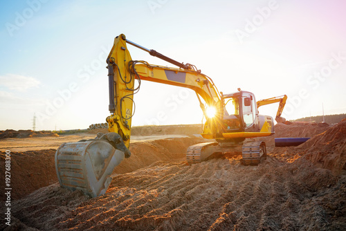 Foto Excavator earthworks on construction site