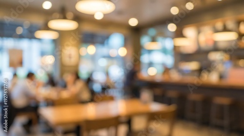 Wallpaper Mural An intentionally blurred, abstract view of a cozy coffee shop or restaurant interior, depicting warm lights and indistinct patrons enjoying their time. Torontodigital.ca