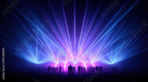 Spectacular laser light show over a crowd of people at a concert or event.