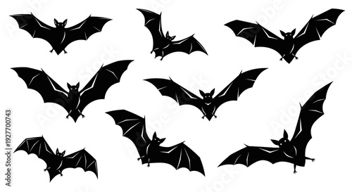 A collection of nine black silhouette bats in various flying poses against a white background.