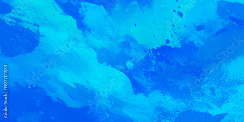 Abstract blue watercolor background with artistic brush strokes and turquoise blue paint and subtle splatters to create a sense of movement and depth.