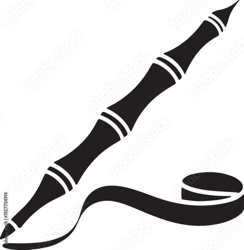 Bamboo pen and ink symbol for writing and education with ink splatter
