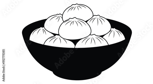 A black bowl filled with several white dumpling shaped objects