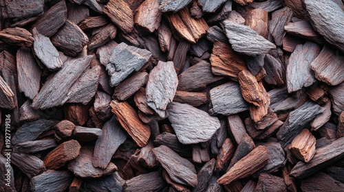 Close-up view of textured wood chips in shades of brown and gray.