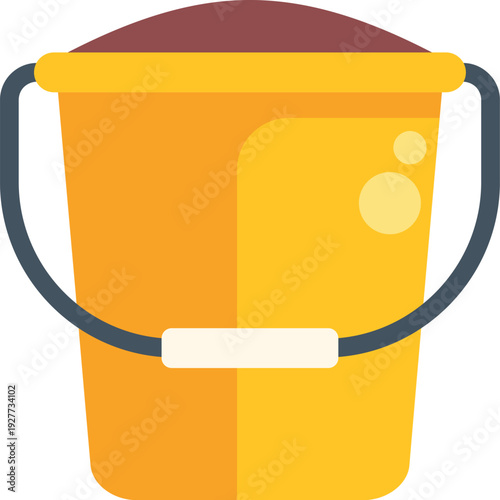 Yellow plastic bucket filled with sand for beach or garden play