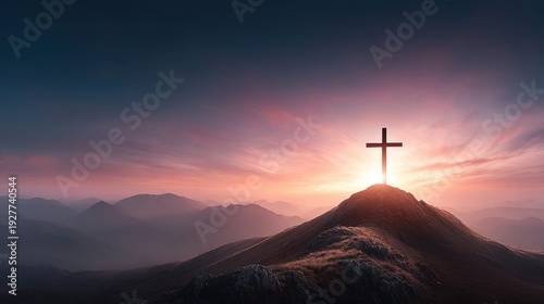 Silhouette of a Christian cross on a mountain peak at sunrise with dramatic sky
