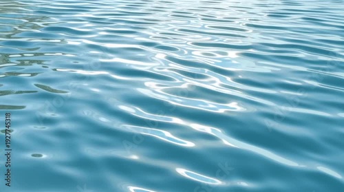 Calm blue water surface with gentle ripples reflecting sunlight