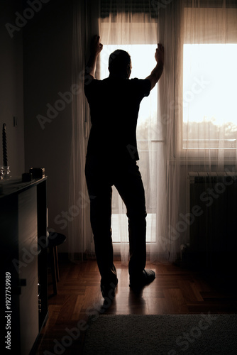 Wallpaper Mural Silhouette of depressed, sad and lonely man in the apartment. Torontodigital.ca