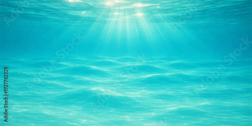 A deep blue ocean underwater scene featuring sunlight rays piercing the clear surface water with reflections and waves against a summer nature landscape horizon