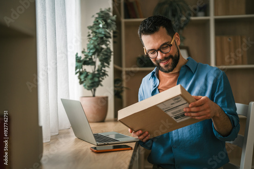 Fotografie Man receiving package for home online shopping delivery