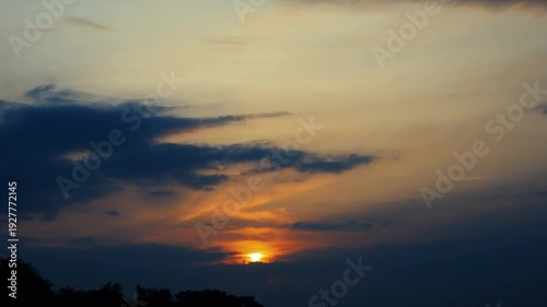 Stunning city timelapse footage capturing the transition from sunrise to sunset, with golden hour light, dramatic clouds, and city lights illuminating the urban skyline in 4K.
