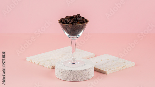 Wallpaper Mural Coffee beans in a wine glass and photo props with a pink backdrop. Torontodigital.ca