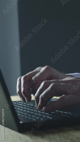 Vertical shot of business man typing on a computer. Digital business strategy creation and content. Business success