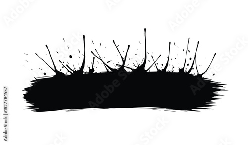 Black ink brush stroke with splatters on for artistic design elements