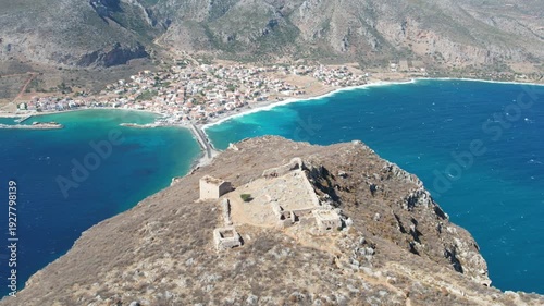 Panoramic aerial of Monemvasia peninsula with medieval castle and bridge