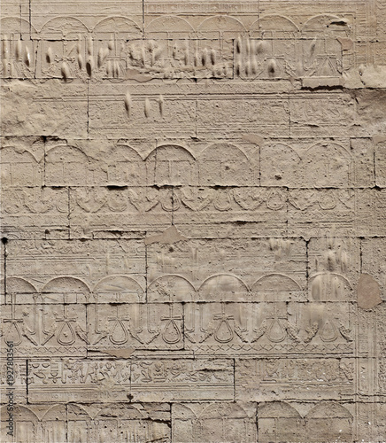 Wallpaper Mural Ancient stone wall carved with detailed horizontal relief patterns Torontodigital.ca